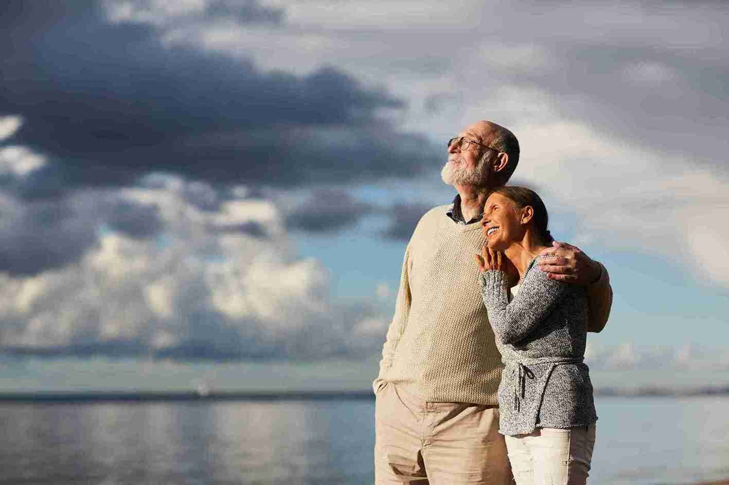 Retired couple reviewing monthly pension and rent budget